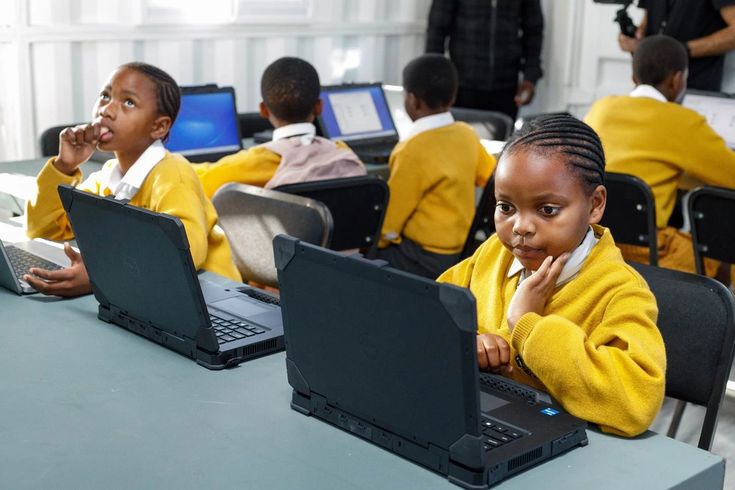 Students in a School computer lab learning code